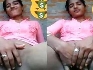Indian webcam employee sits in front of camera and stimulatea slit