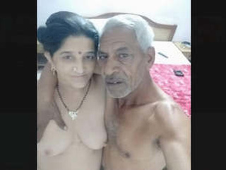 Indian grandpa and nubile female engage in individual activities