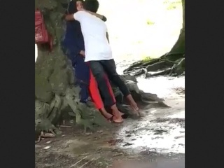 A veiled lady and her partner delectation each other in public