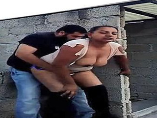 Excited couple engages in al fresco intimacy