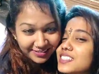 Two Indian damsels engage in a sensuous and romantic smooching scene