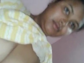 A enticing Indian housewife engages in explicit sexual activity