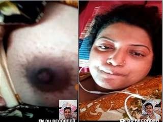Desi bhabhi uncovers her milk cans to her partner in a individual  call