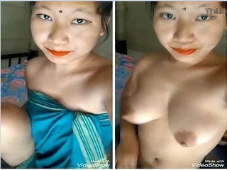 See a splendid girl disrobe down and expose her titties and individual parts