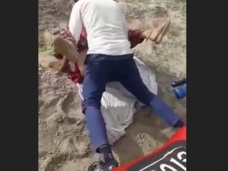 A Rajasthani nymph engages in sexual action with 2 men in an outdoor setting