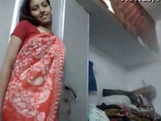 A teen's inviting disrobe display in a saree for financial gain