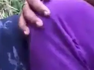 A lady from a mallu background gives oral bang-out outdoors while displaying her melons